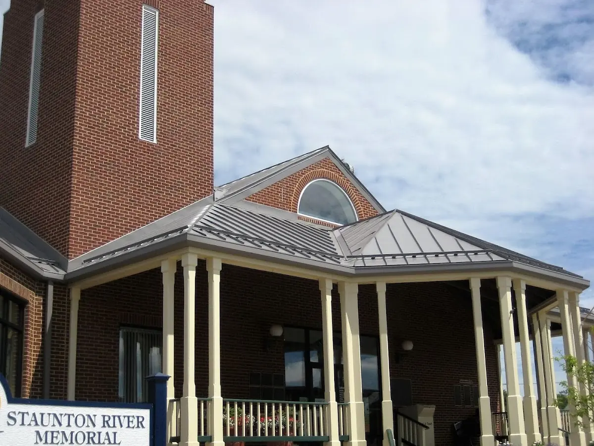Skilled roofing craftsmen working on a residential roof in Taylorville